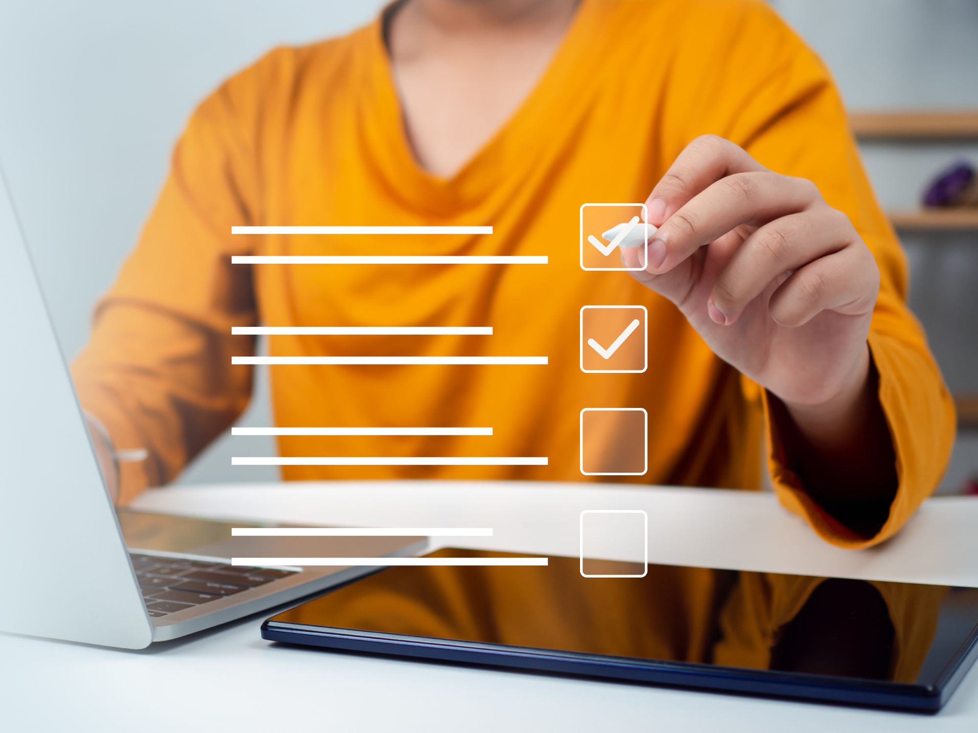 Person checking boxes on digital checklist representing website launch checklist article on Host Easy (Australian web hosting)