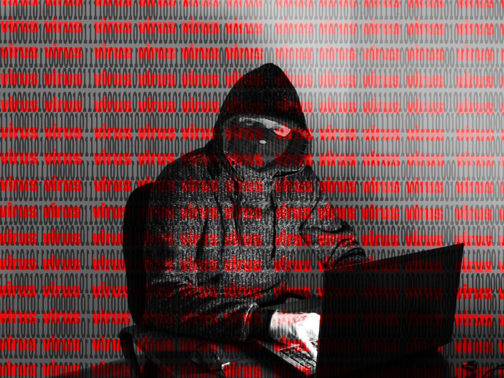 Illustration of a hacker breaching a website representing how websites get hacked article on Host Easy (Australian web hosting)